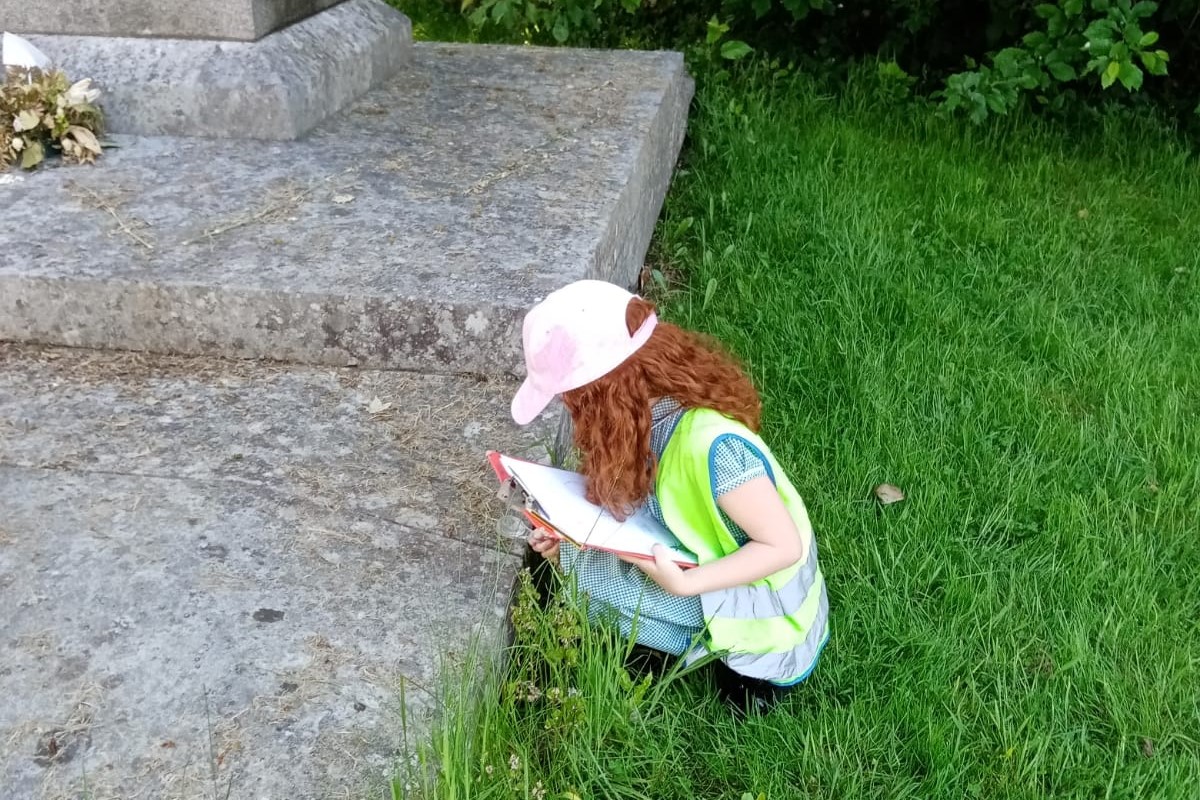 Girl inspecting monument