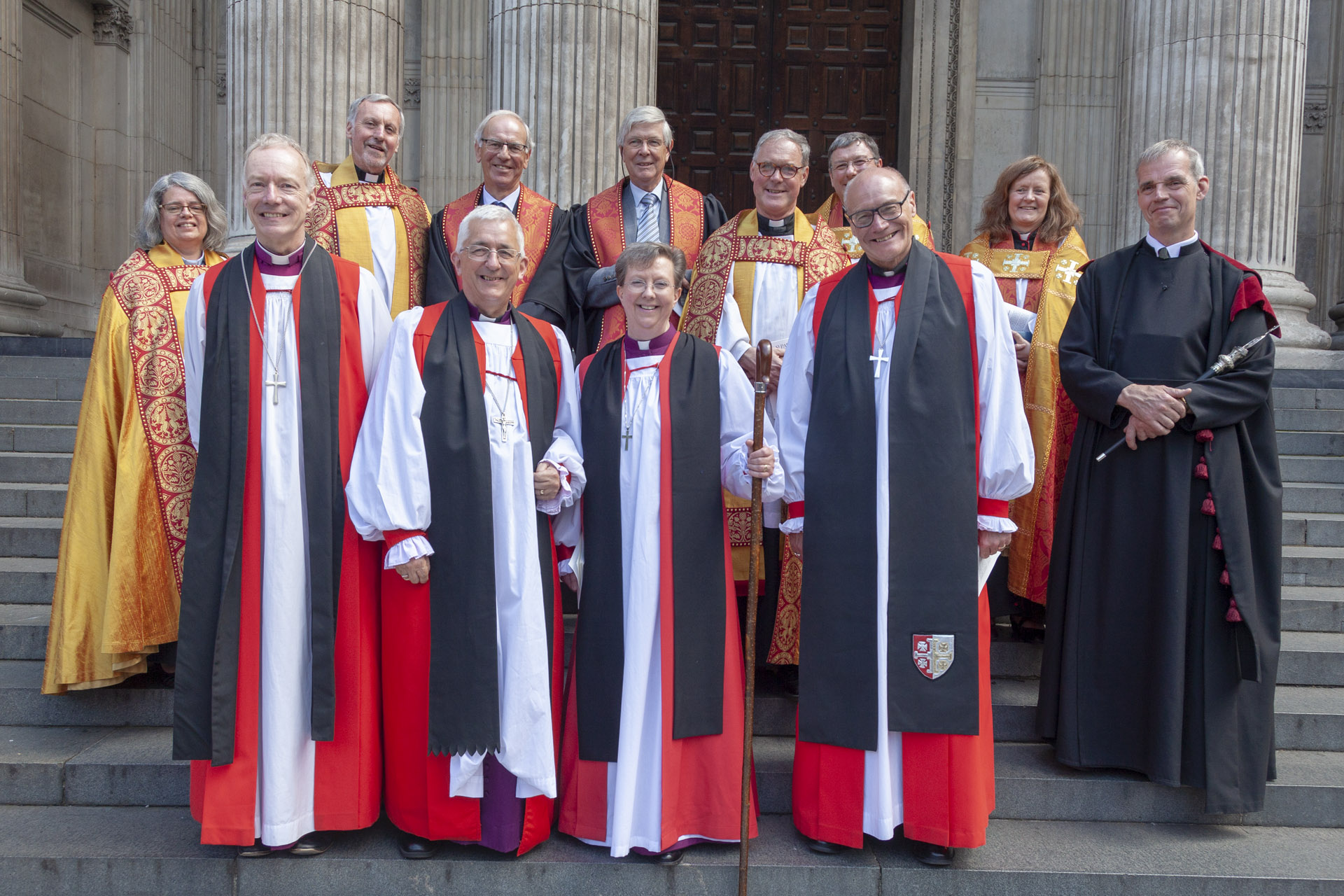 Newly-consecrated Bishop Sarah along with Bishops Michael, Clive & Geoff, Archdeacons and others on the steps of St Pauls Cathedral, London, after the service